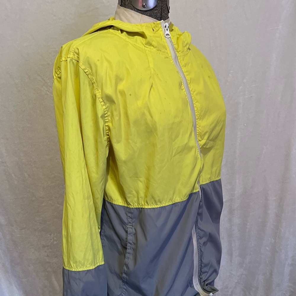 White and grey rain coat